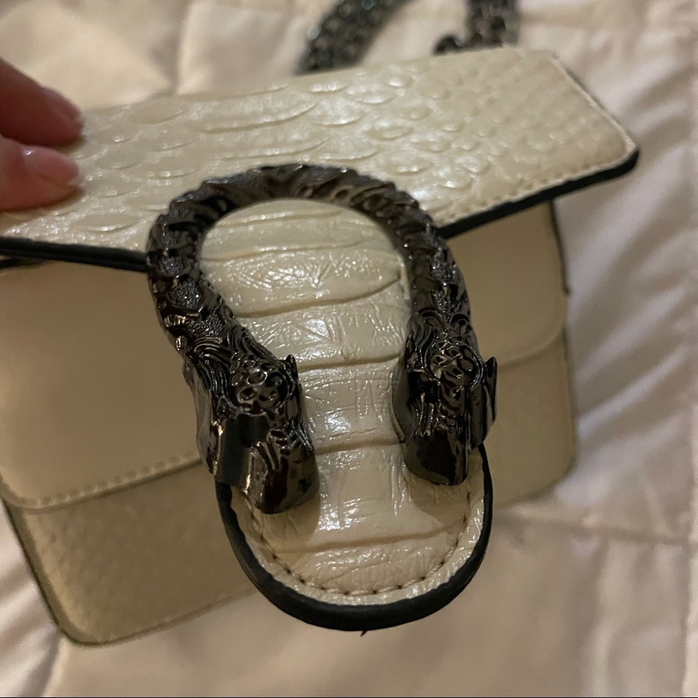 snakeskin crossbody bag with dragon details